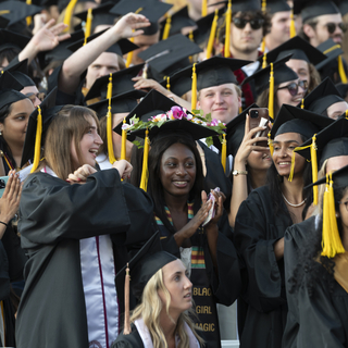 Graduating students celebrate at McGuirk Stadium prior to 2025 Undergraduate Commencement